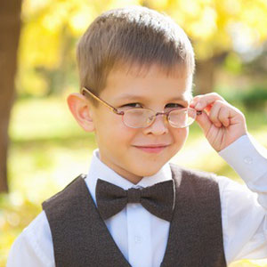 young boy wearing premium frames