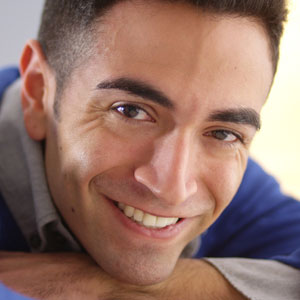Smiling man wearing contact lenses